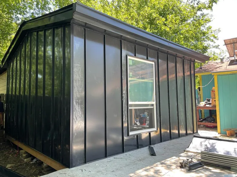 Black standing seam metal wall panels for Roof Inspection in Prescott