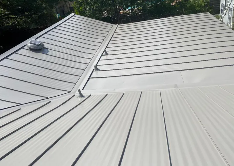 Solar attic fan installed on a metal roof for Roof Ventilation in Prescott